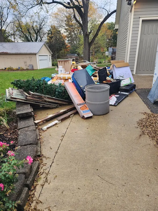 Dumpster being loaded with debris for Commercial Dumpster Rental in Bristow